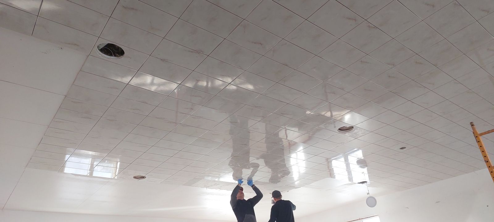 Commercial ceiling tile installation in progress