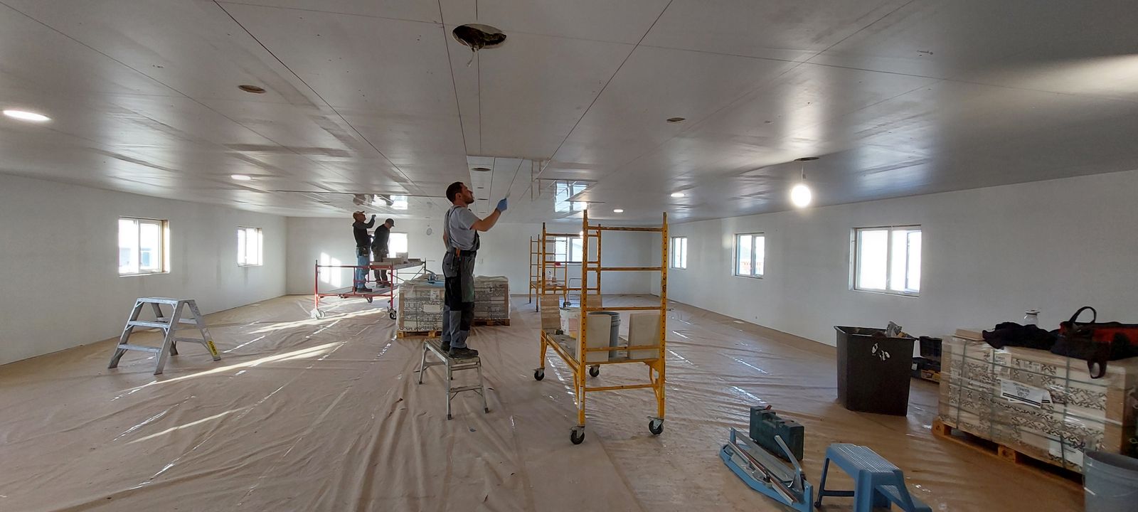 Large commercial space ceiling tile installation